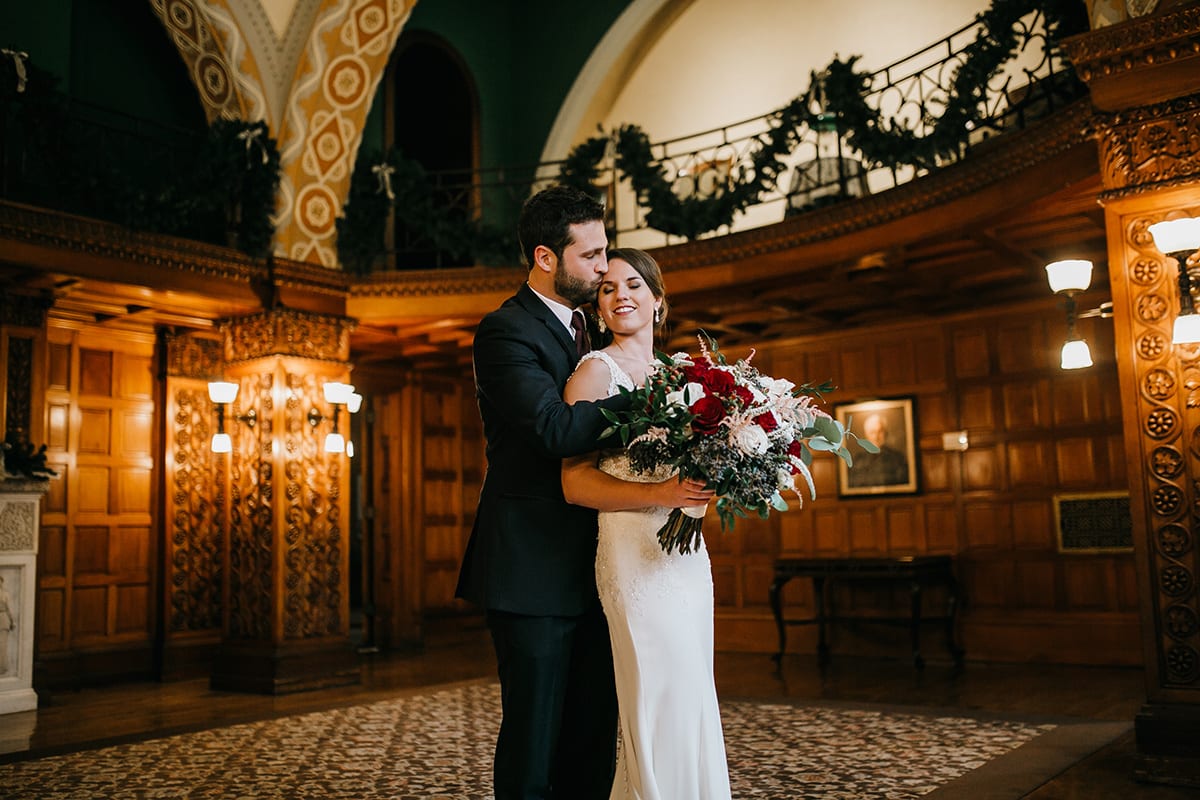 Rachel Traxler Photography, Landmark Center, Landmark Center wedding, Saint Paul wedding, wedding venues, winter flowers, winter bouquet, burgundy bouquet, red bouquet, red flowers, burgundy flowers, winter wedding inspiration, winter bride, winter flowers, winter bouquet, Saint Paul wedding florist, Minneapolis wedding florist, Artemisia Studios